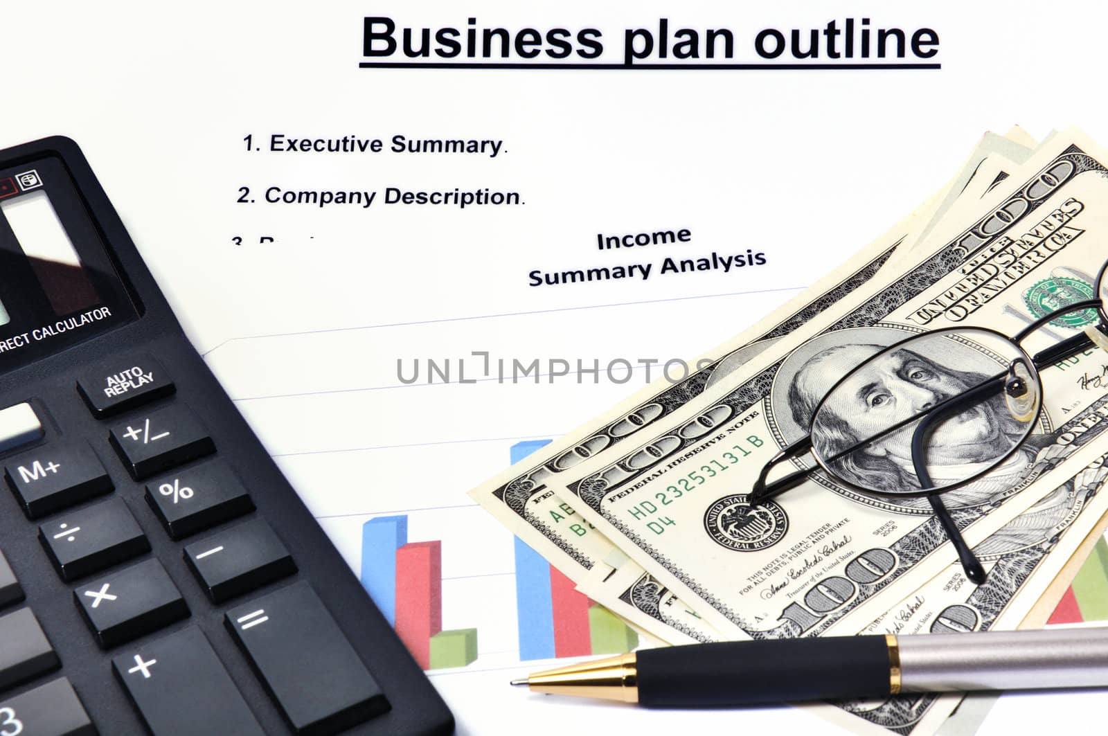 Business plan with graphical analysis, money, calculator and pen by lobzik