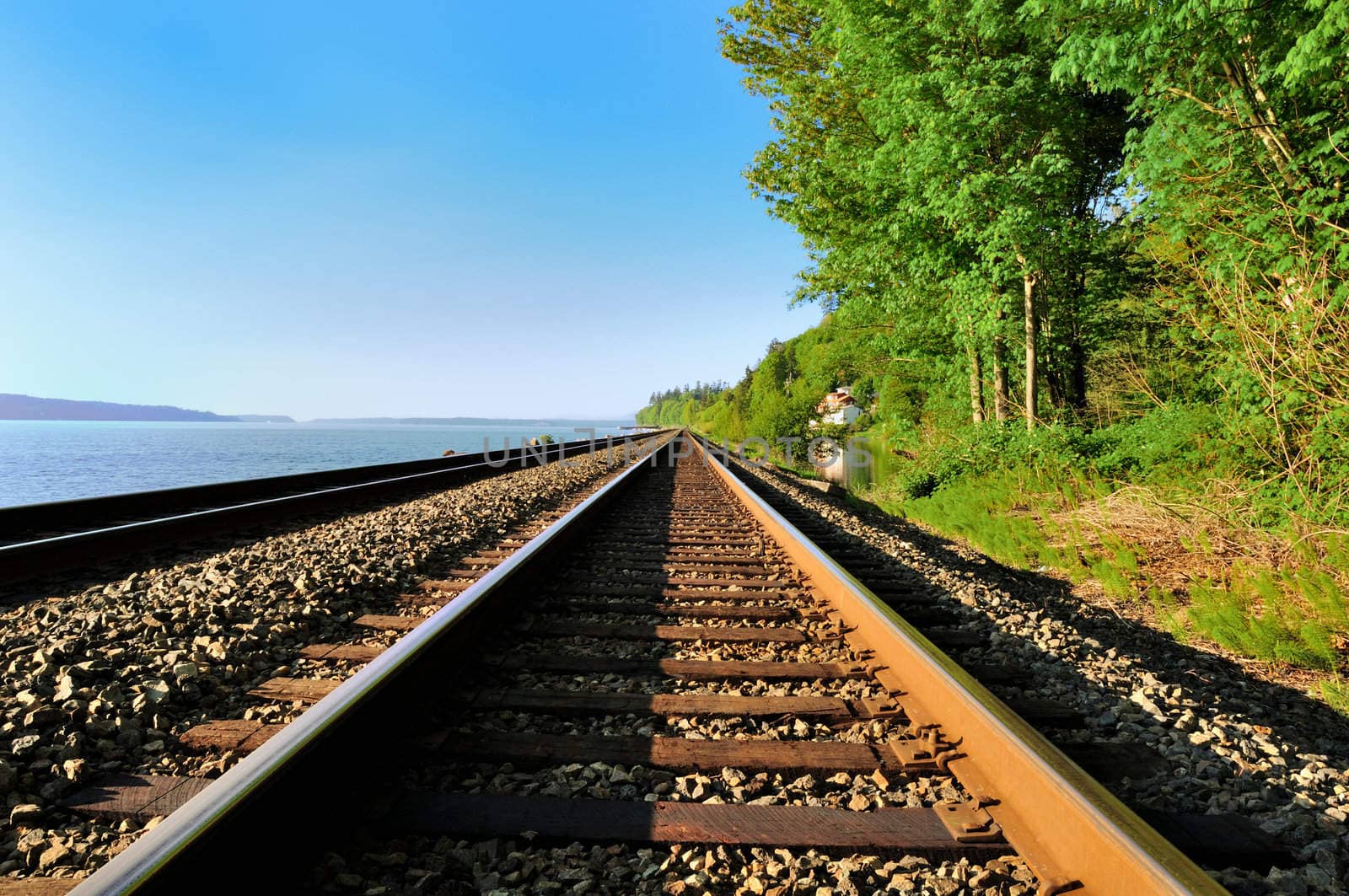 The railroad along the bay on the west coast of the USA.