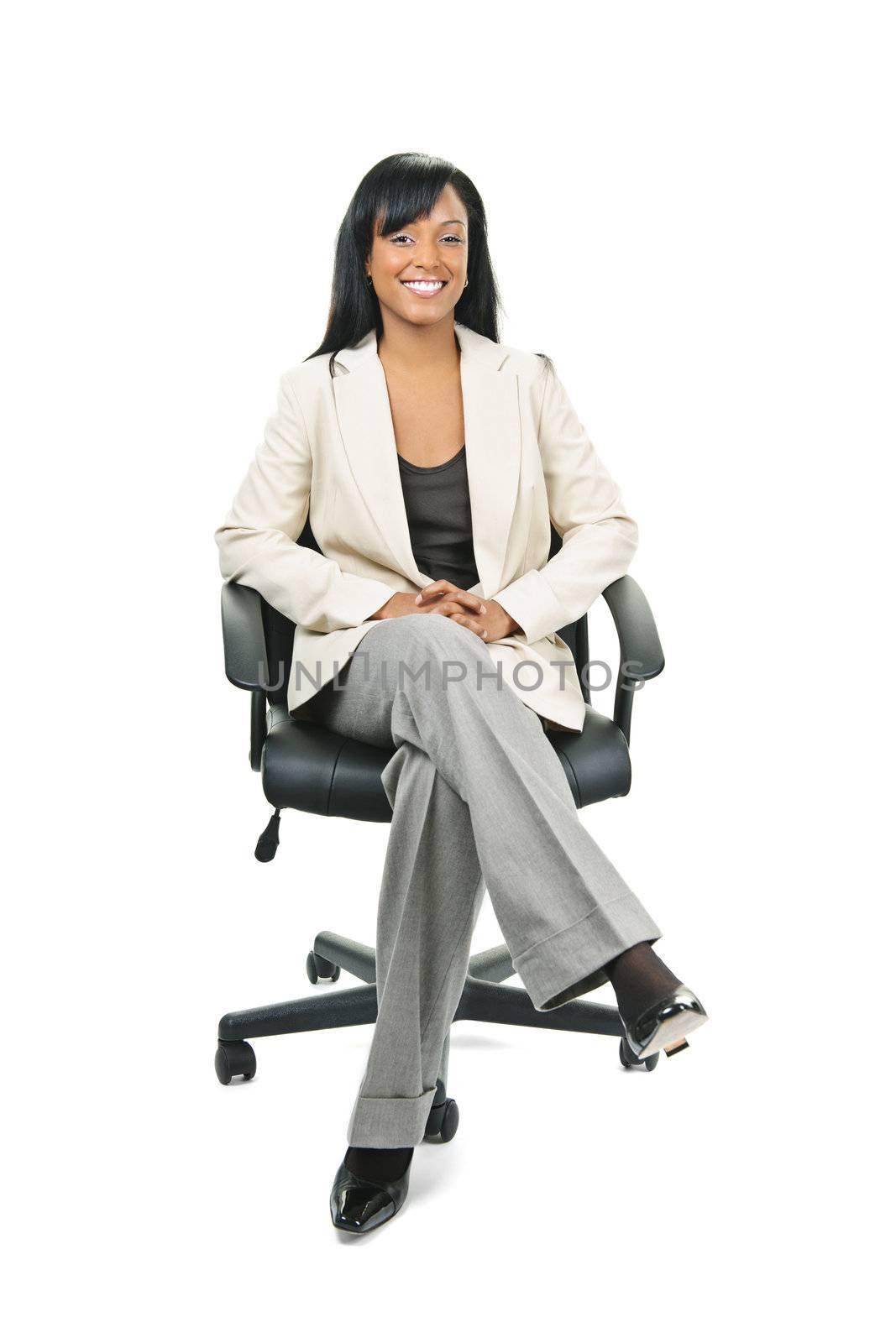 Young smiling black woman business manager sitting in leather office chair