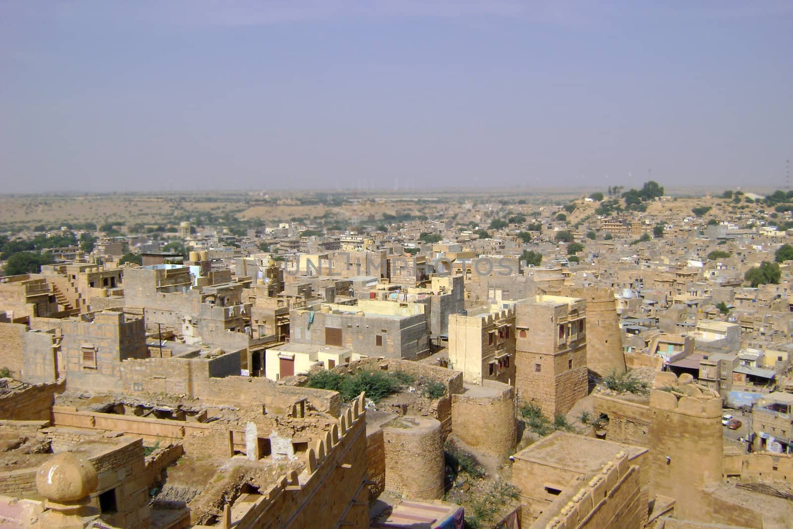 An Indian in Rajasthan state, with ancient architecture.