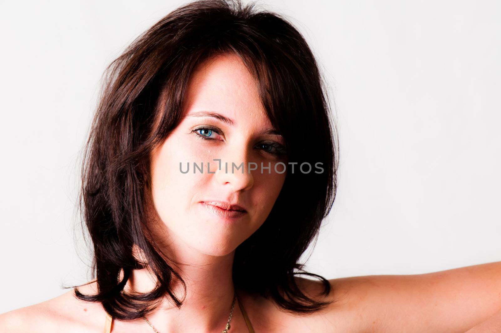 sexy image of beautiful young brunette blue eyed model standing and smiling
