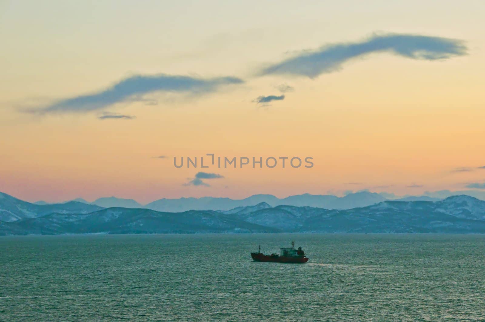 The ship in the sea near to coast