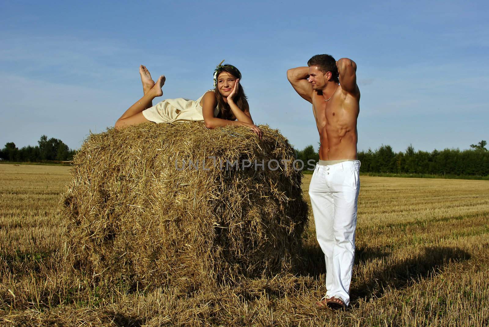bodybuilder with a cute girl in the countryside