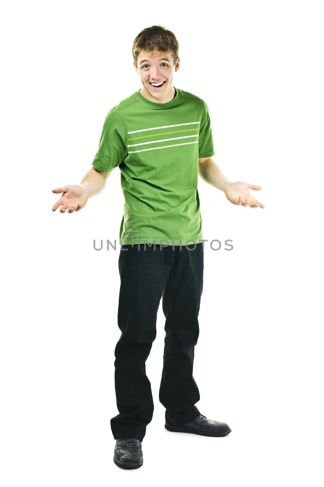 Shrugging smiling young man standing isolated on white background