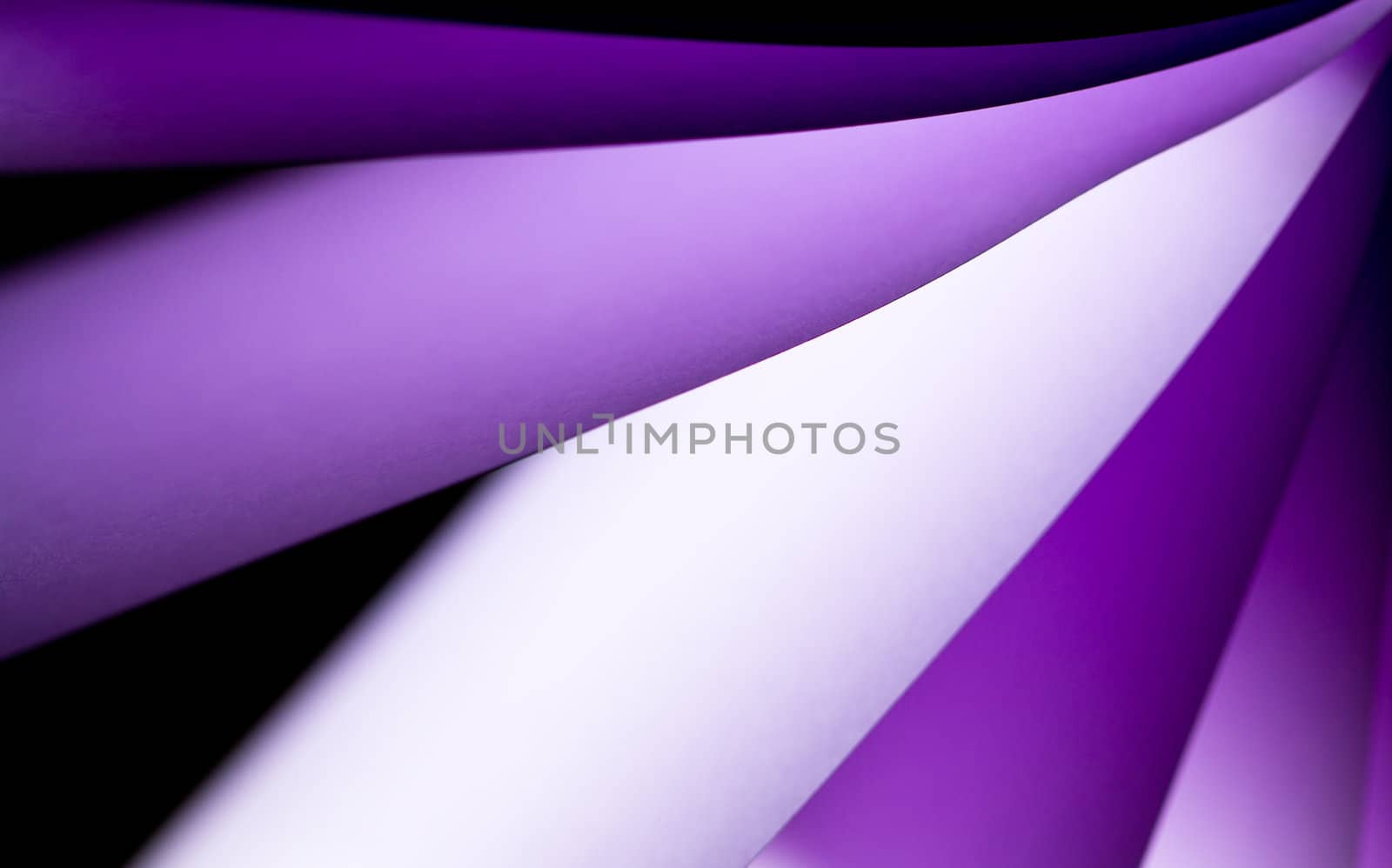 purple notepad paper illuminated by LED lights from upper right in landscape orientation
