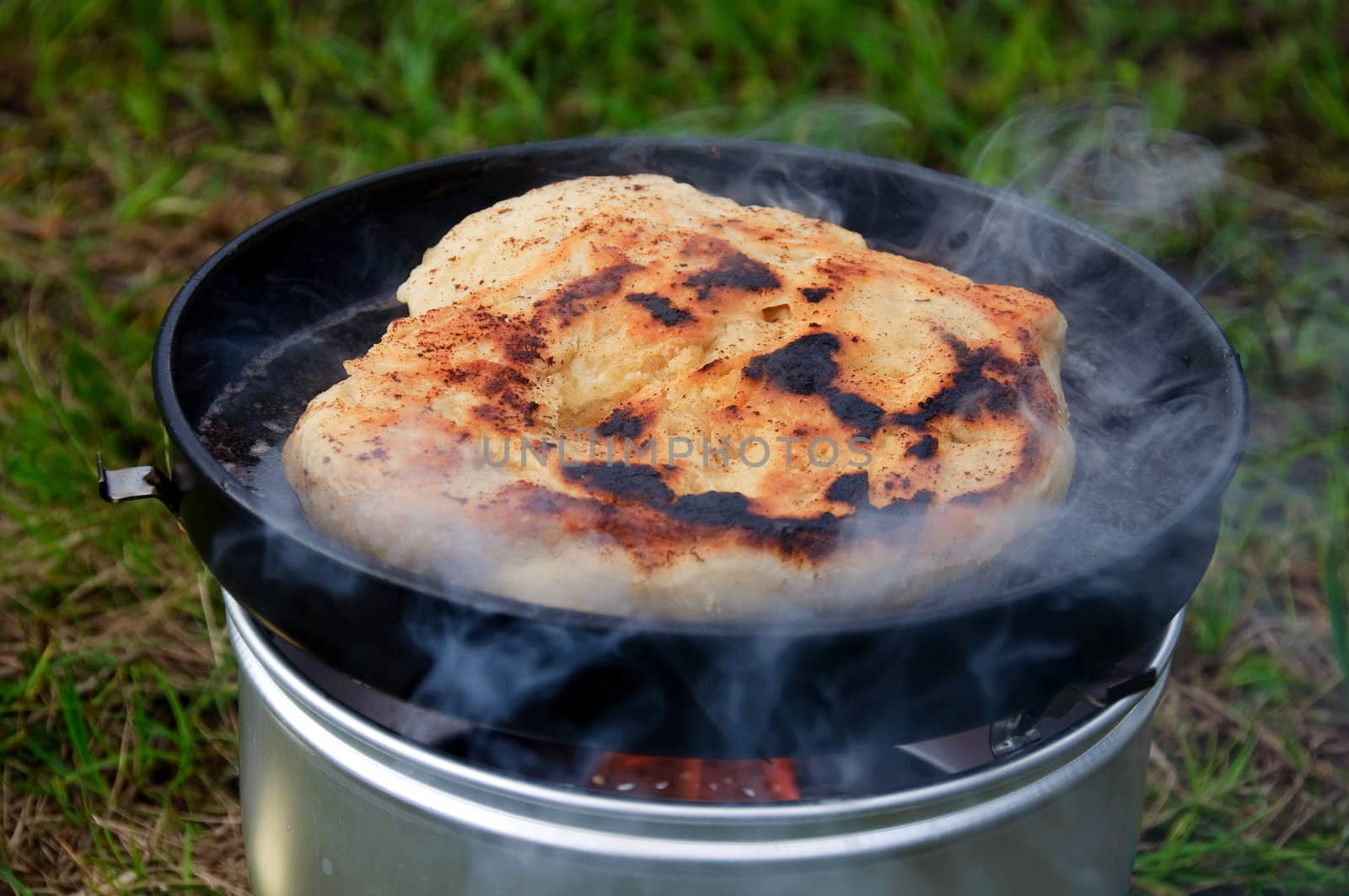 Baking bread outdoor on a camping stove