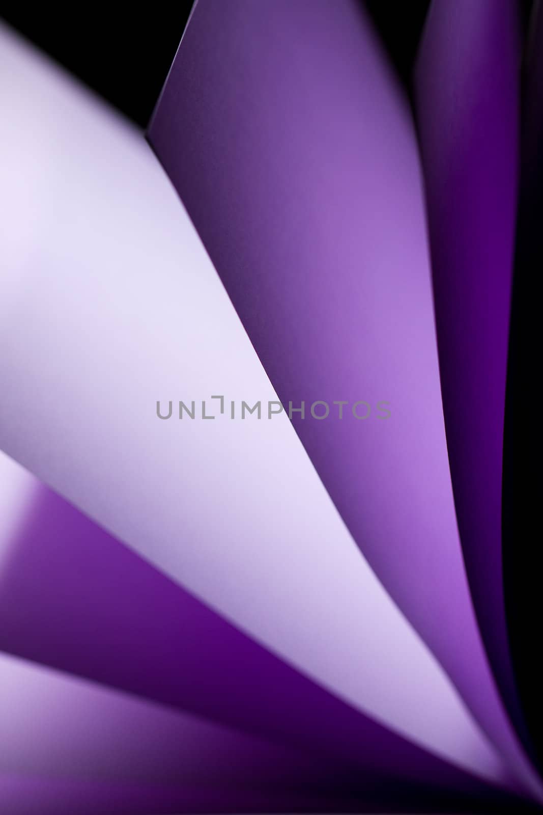 purple notepad paper illuminated by LED lights arise from lower left in portrait orientation