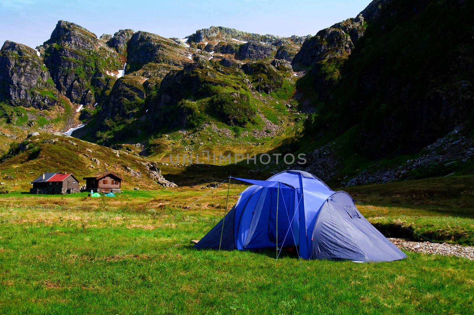 Camping tent in the mountains at a summer farm