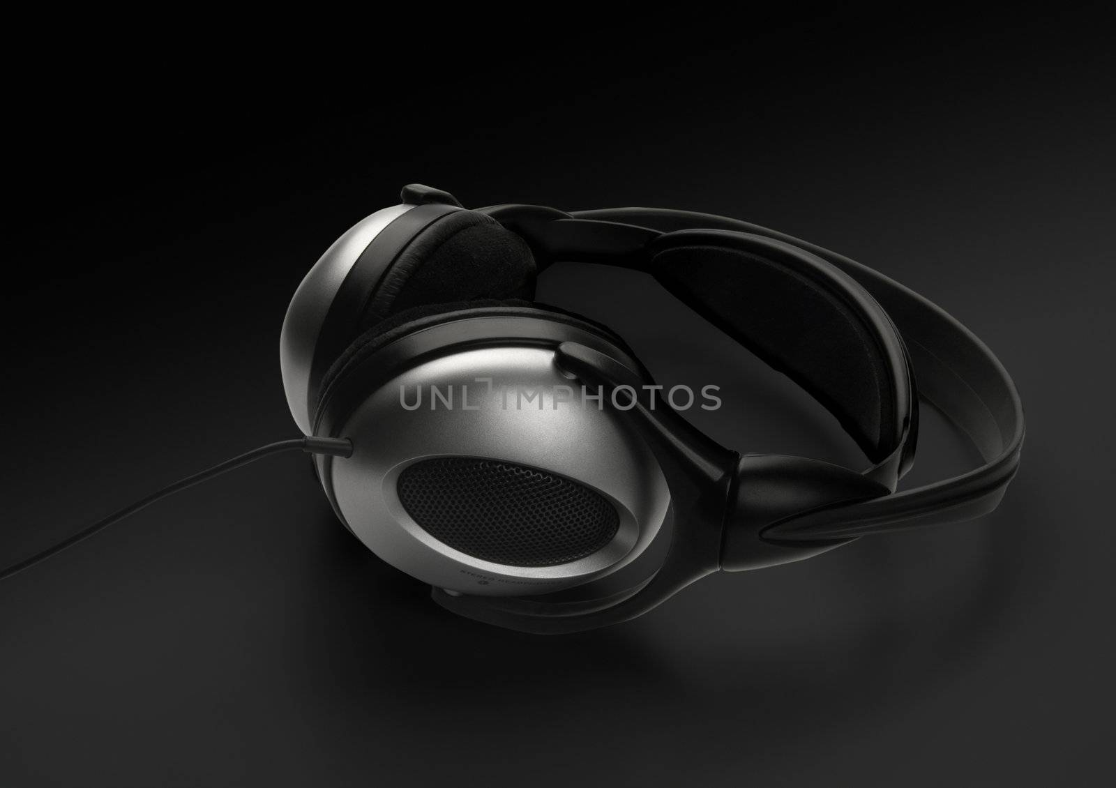 Headphones, isolated on black background.