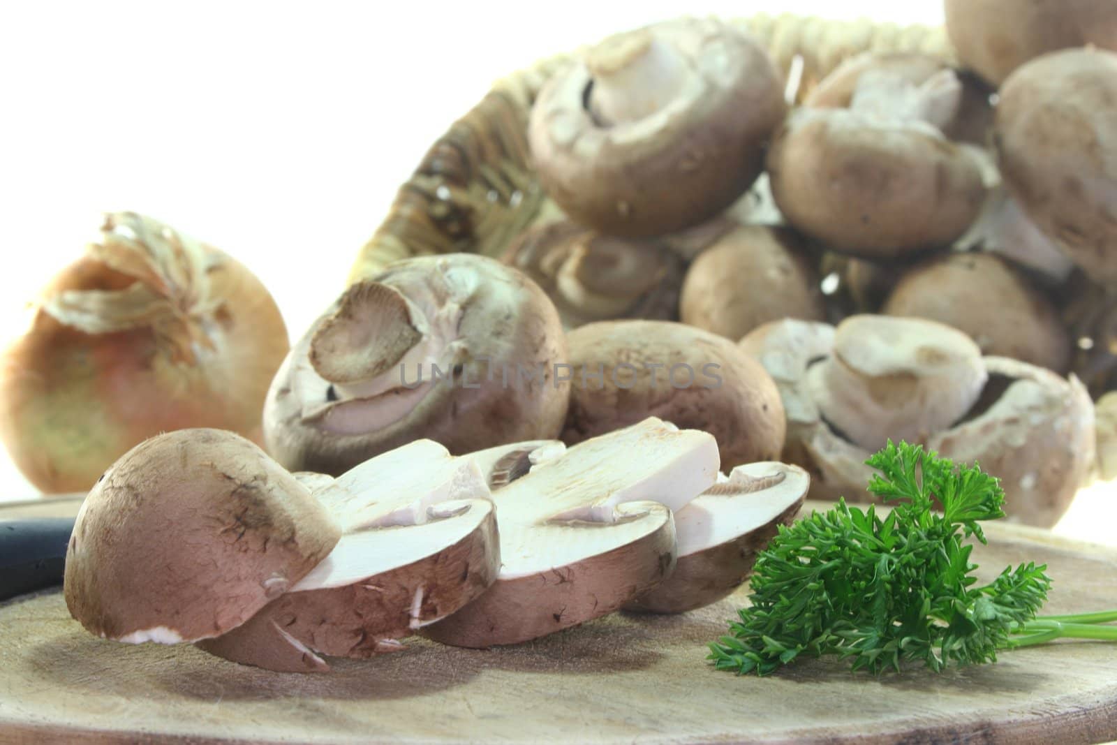 fresh mushrooms with parsley on a white background