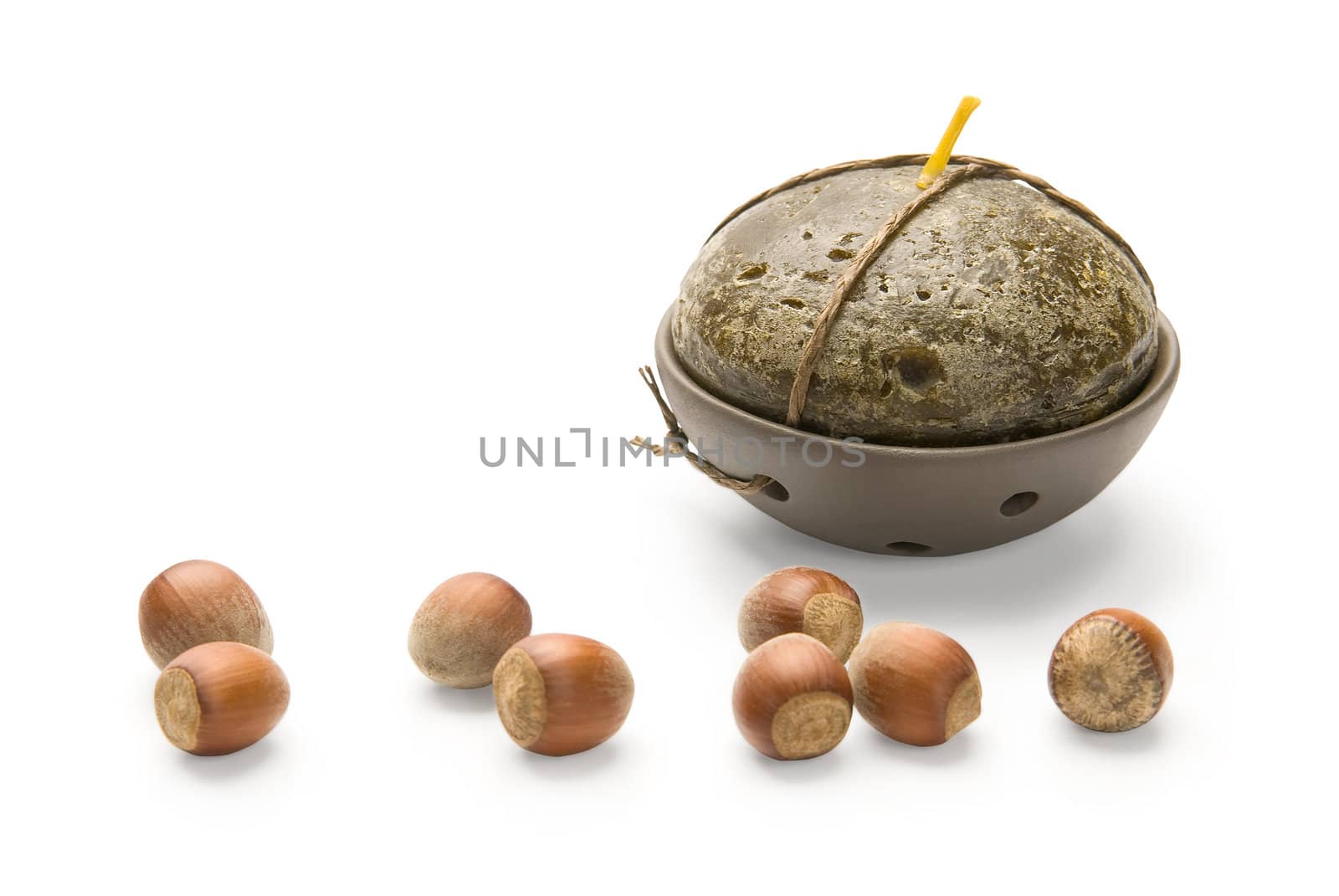 Hazelnuts and Candle, isolated on white background by zeffss