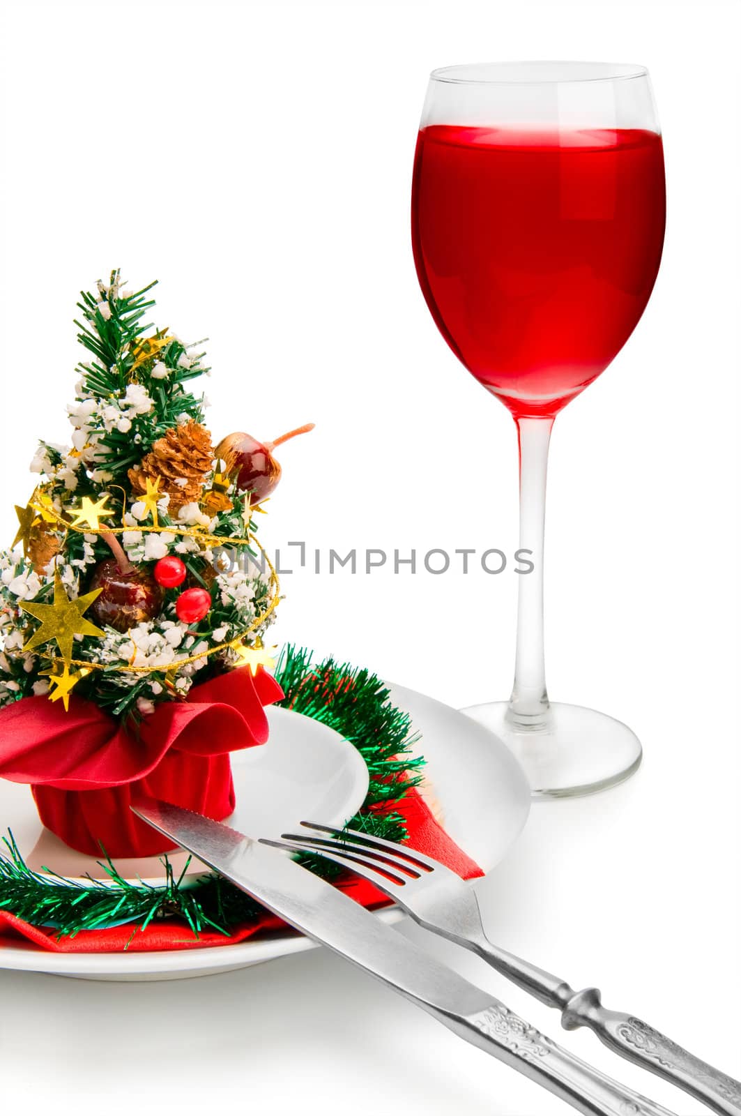 glass of red wine and Christmas decoration, isolated on white background