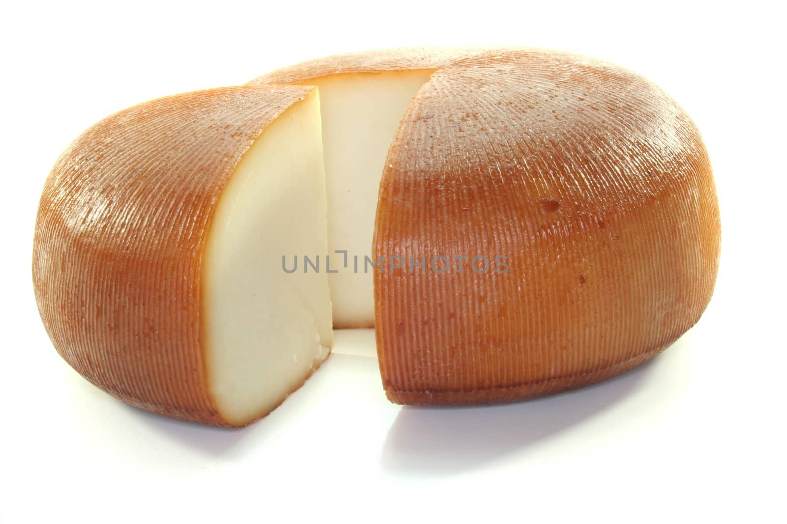 a loaf of smoked goat cheese on a white background