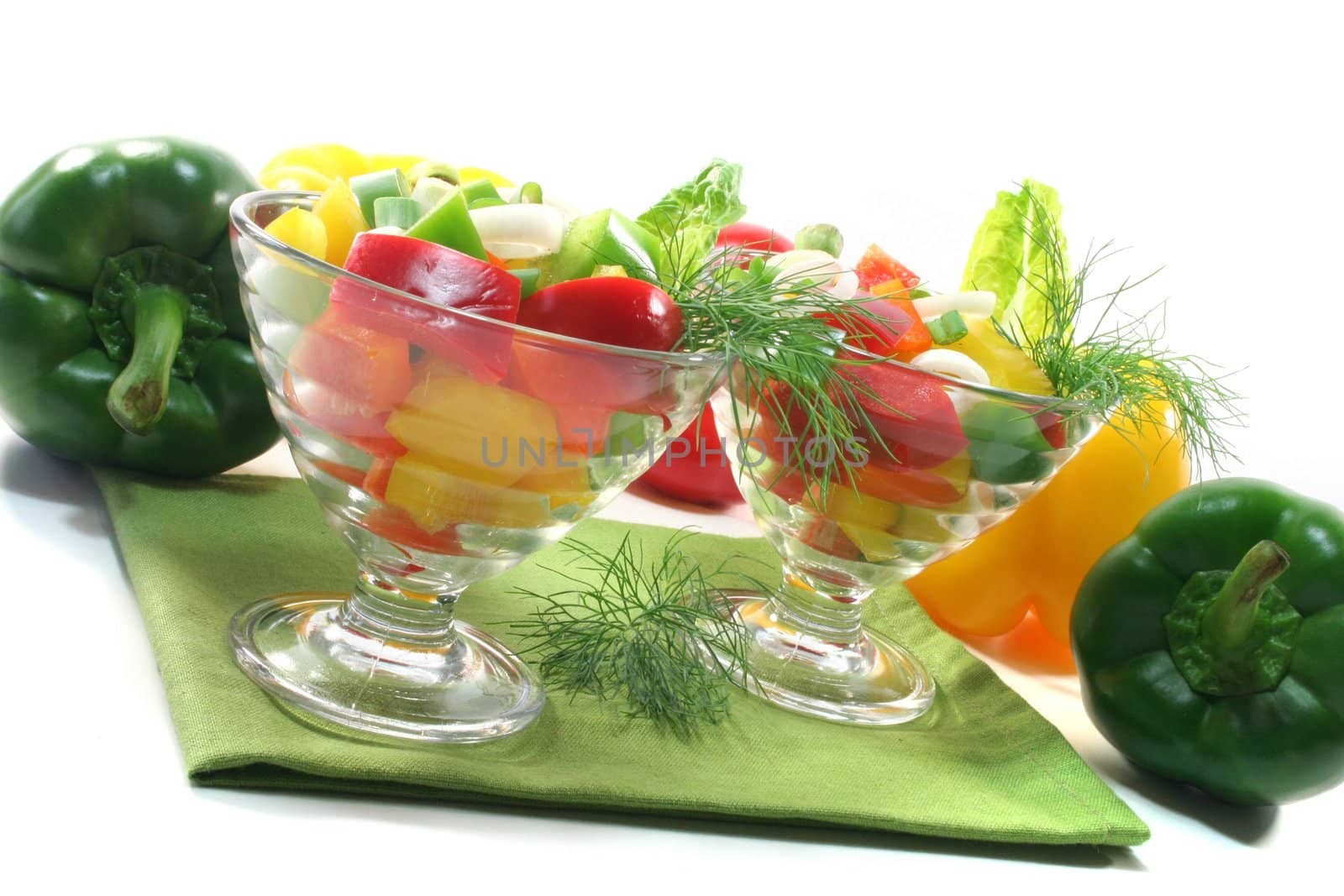 colorful bell pepper salad with dill in small glass bowls