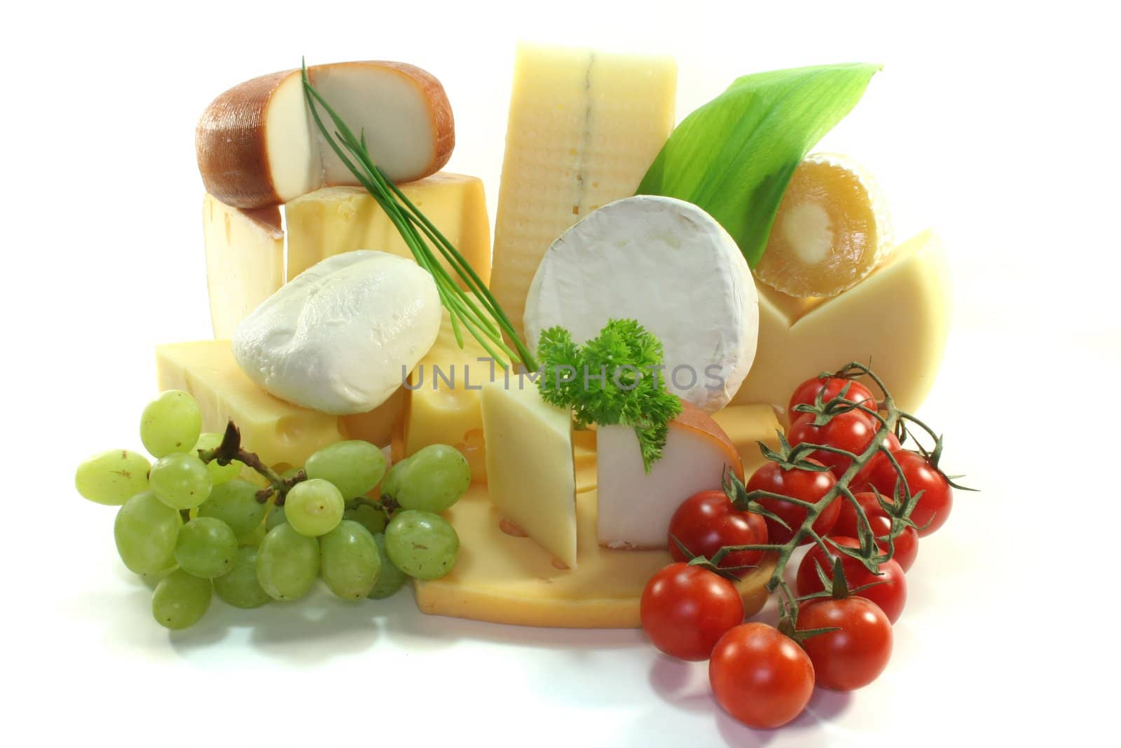 various Cheese with fresh grapes and tomatoes