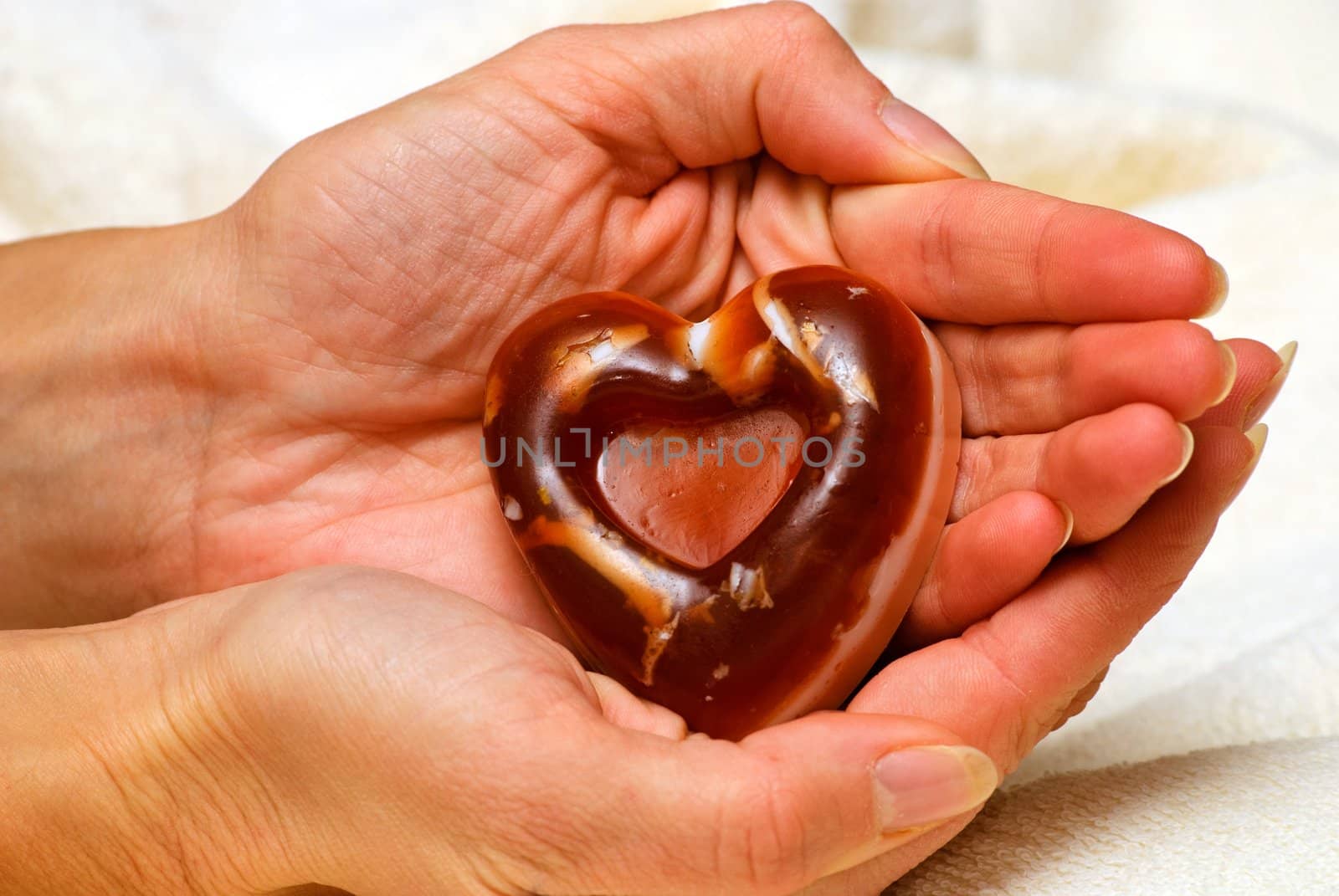 Natural Handmade Heart-Shaped Soap in female hand