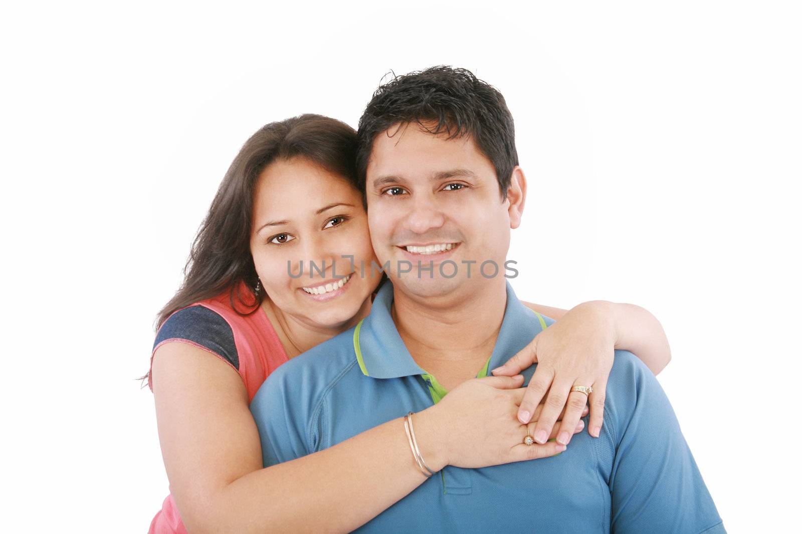 Portrait of a beautiful young happy smiling couple - isolated