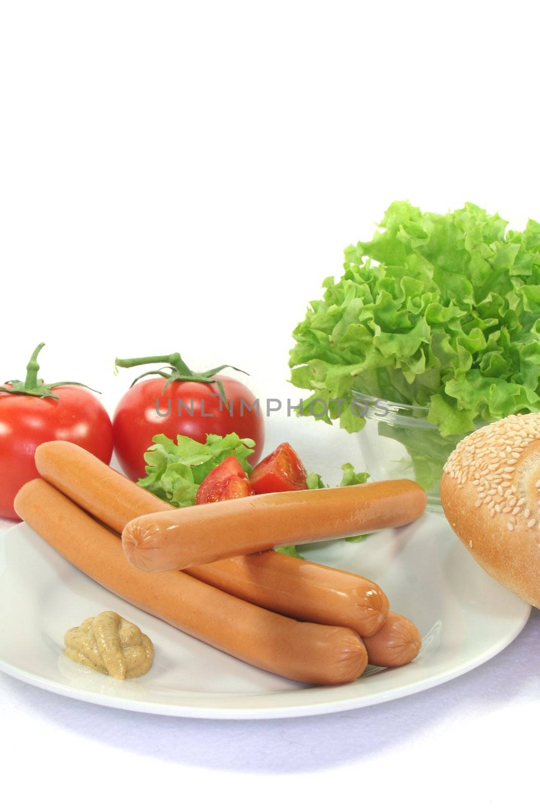 Wiener Sausage with Sesame bun and lettuce on a white background