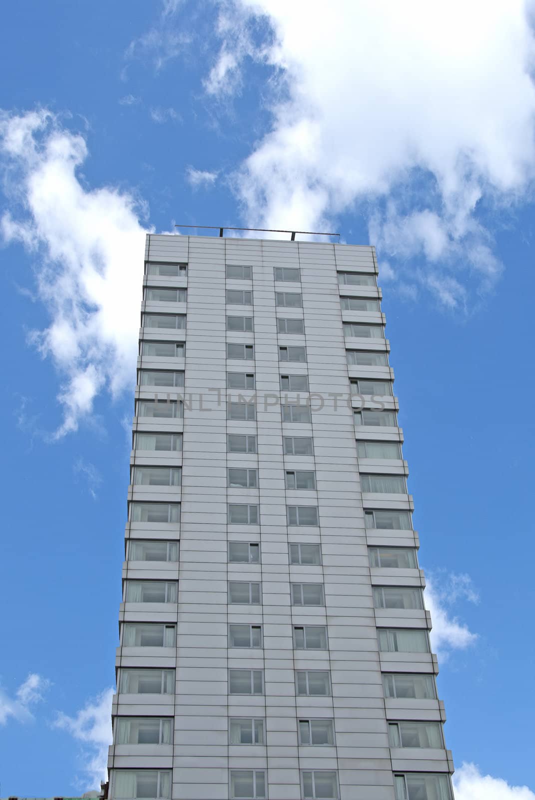 Grey Apartment Block against a blue sky