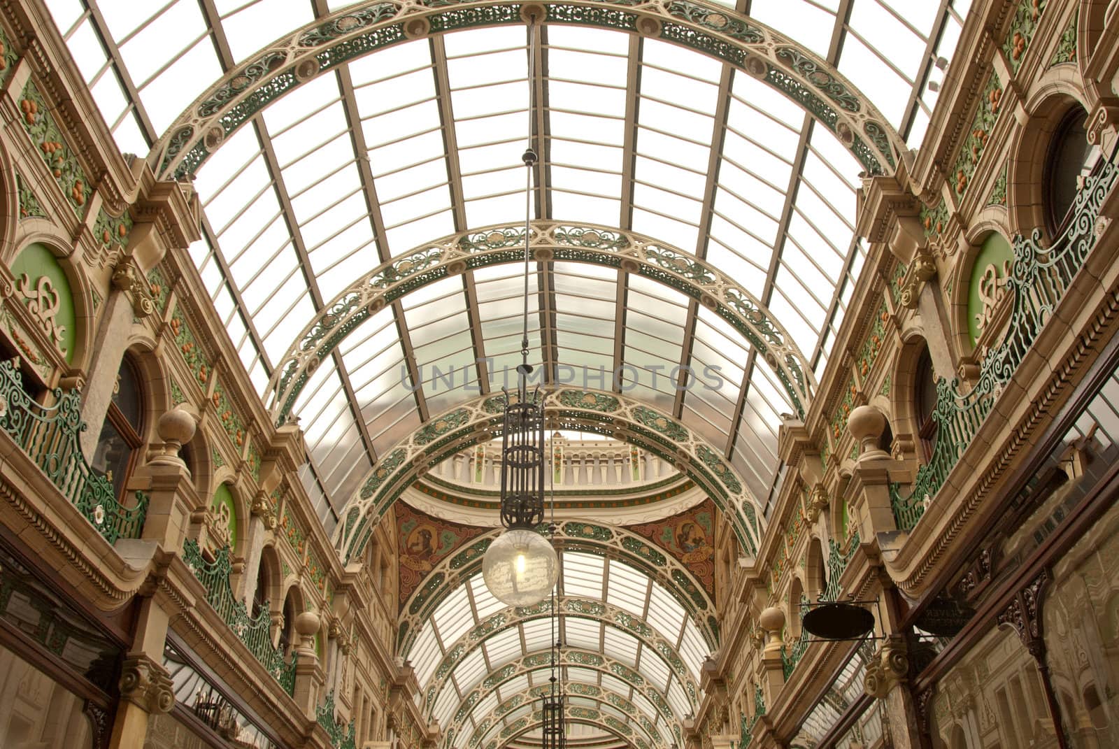 Detail of a  Nineteenth Century Market Arcade with domed Glass Roof Ornate Colourful Ironwork