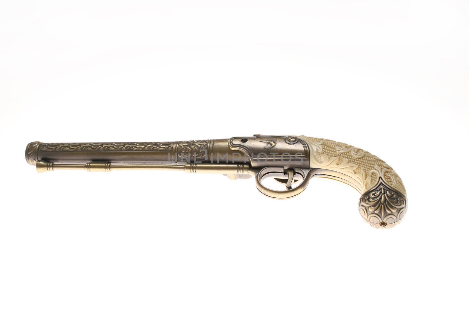Antique gun, isolated on white by haiderazim