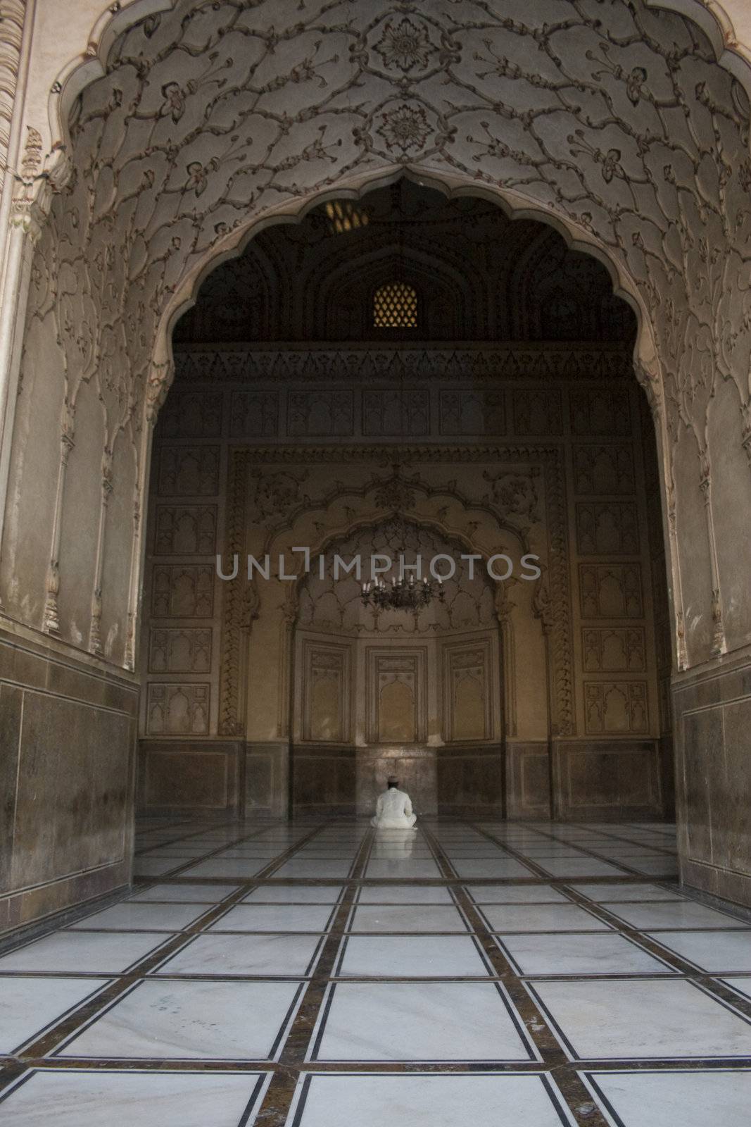 Man sitting praying in mosque