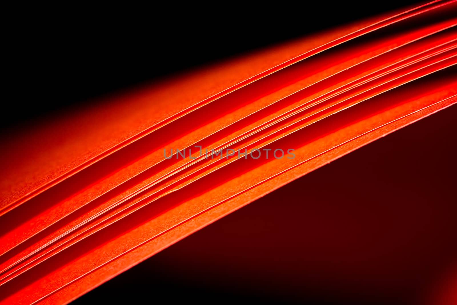 Red A4 paper illuminated with LED light can be use as background abstract