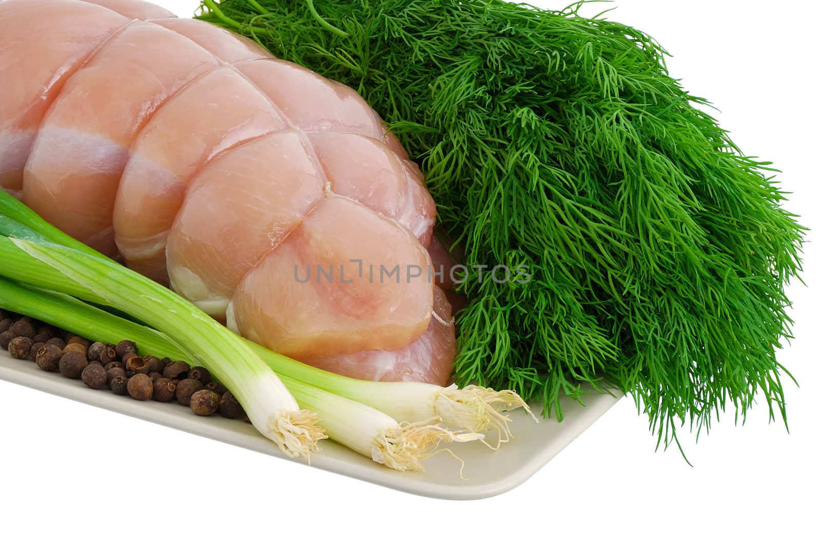 Bound turkey breast with green vegetables on plate isolated on white background