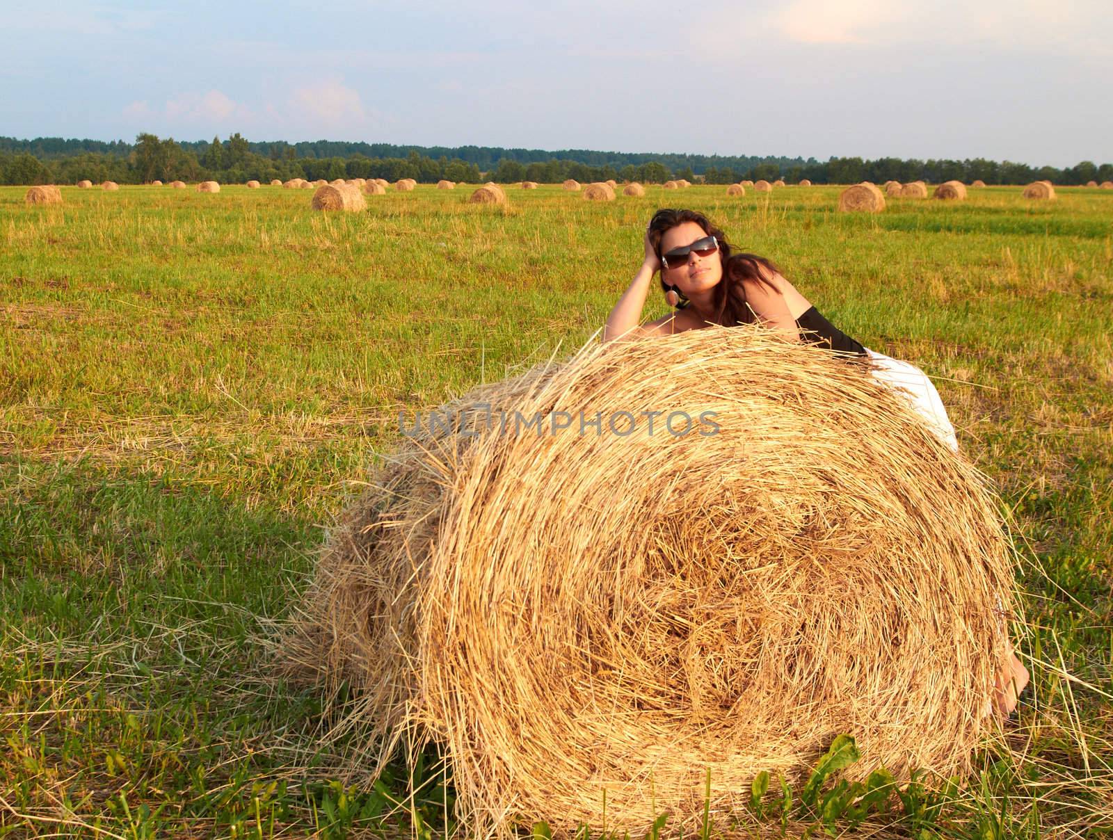 Girl near roll of hay. by michey