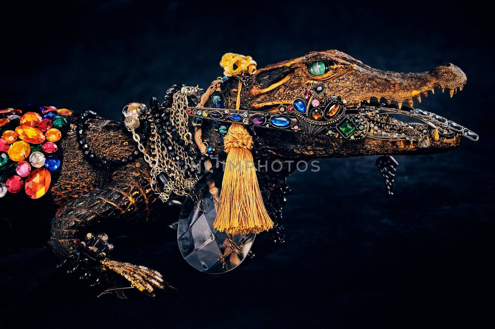 Vintage bijouterie hang on the stuffed crocodile