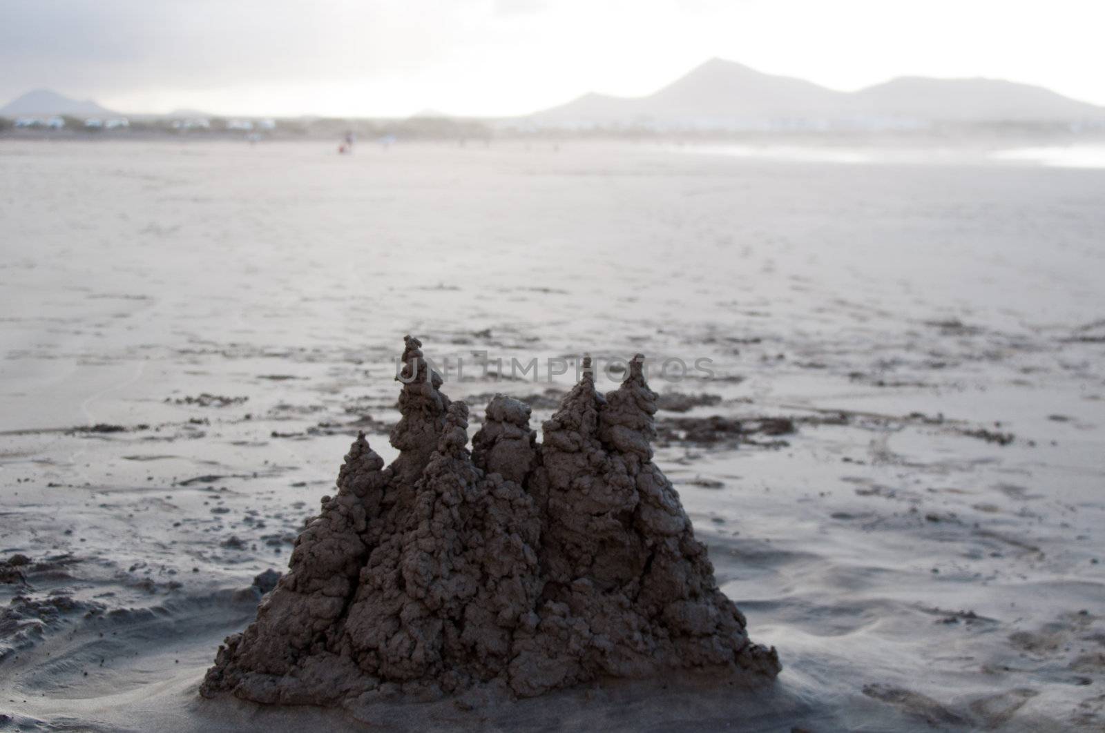 Sand castle in beautiful Sunset On Famara Beach, Lanzarote, Canary Islands, Spain