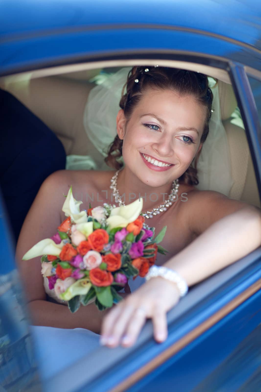 portrait of the bride in the car