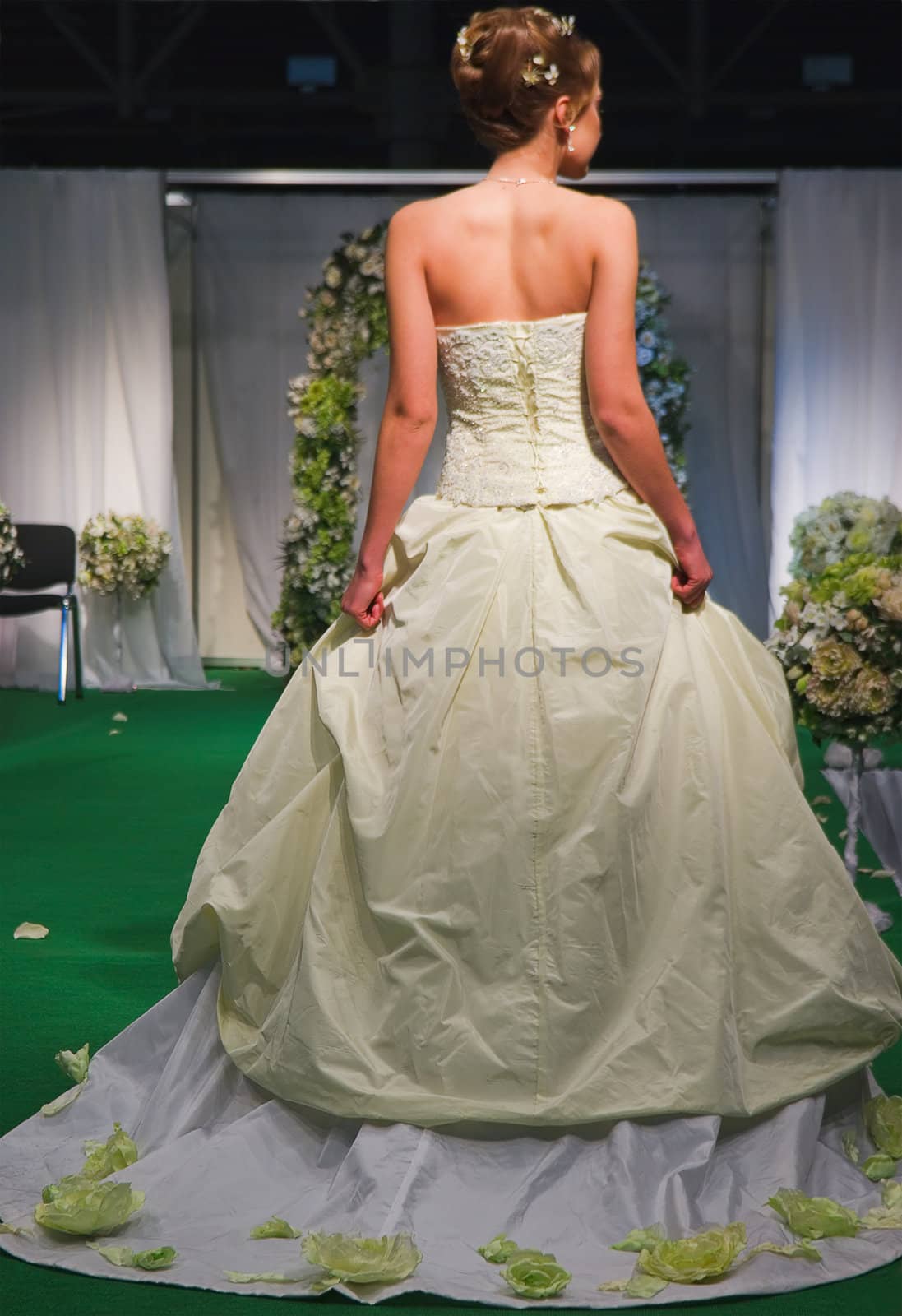 Beautiful woman in white wide wedding dress