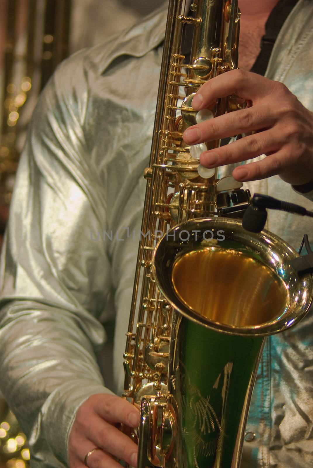 fingers playing a saxophone