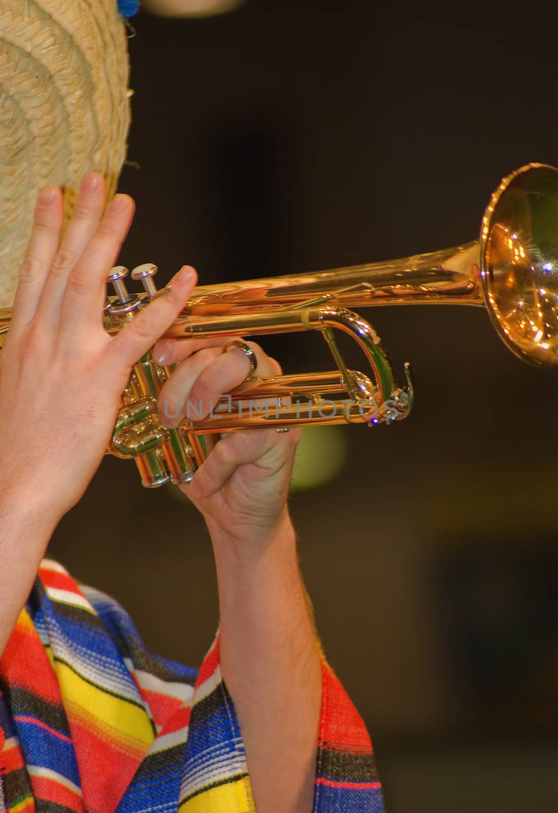 
A man playing his wind instrument with expression.