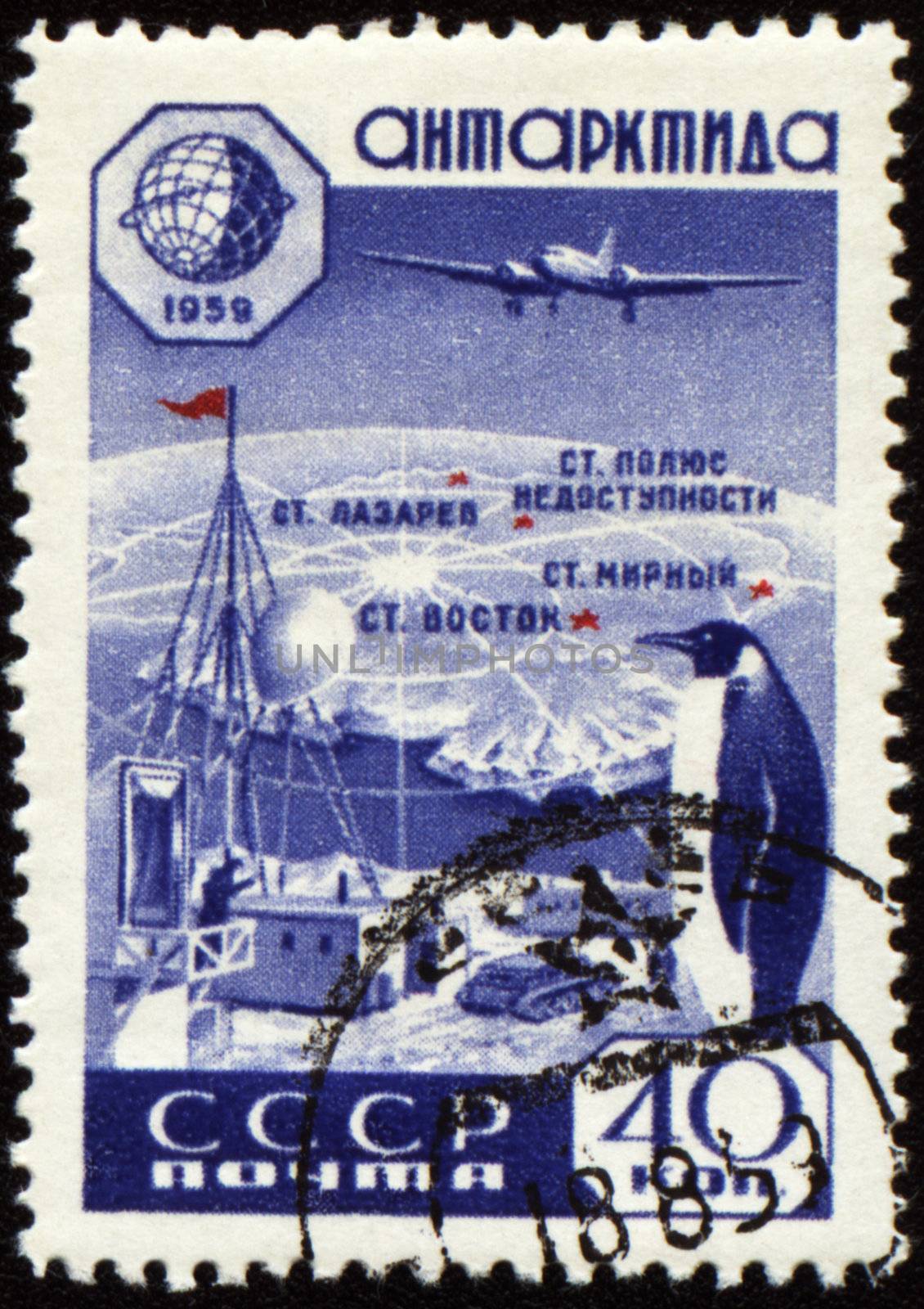 USSR - CIRCA 1959: stamp printed in USSR, shows Research station in Antarctica, map, plane and penguin, circa 1959