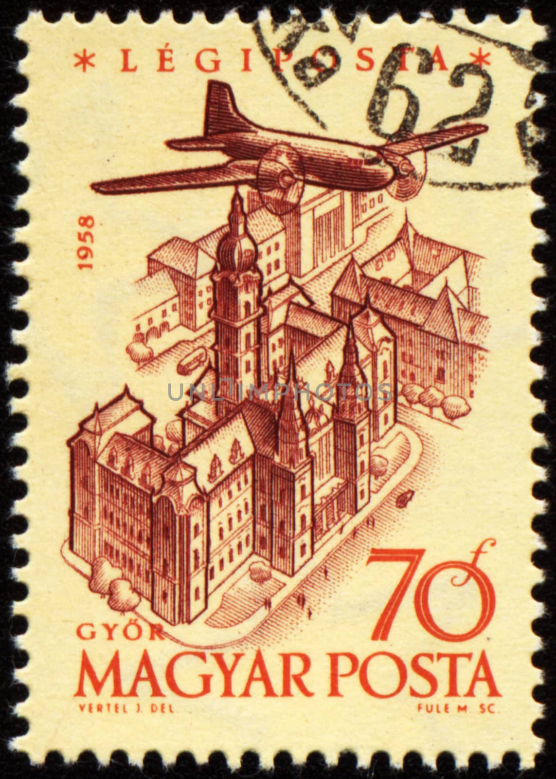 HUNGARY - CIRCA 1958: A stamp printed in Hungary shows flying plane over the Gyor town, series, circa 1958