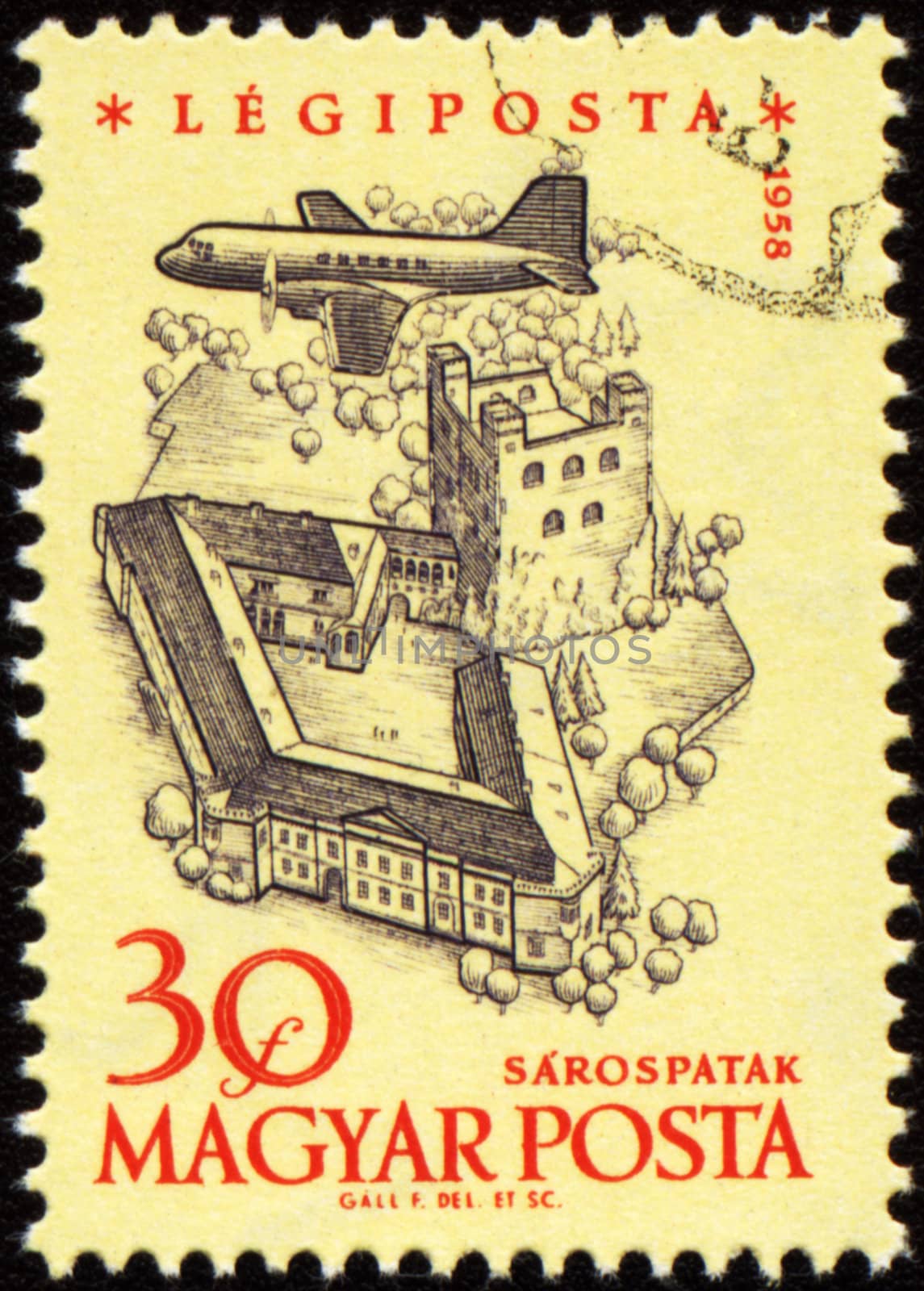 HUNGARY - CIRCA 1958: A stamp printed in Hungary shows flying plane over the medieval Sarospatak castle, series, circa 1958