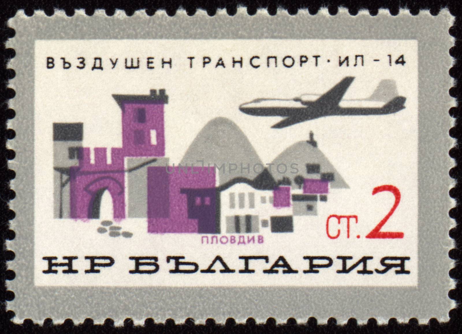 BULGARIA - CIRCA 1965: A stamp printed in Bulgaria shows flying plane over the Plovdiv town, series, circa 1965