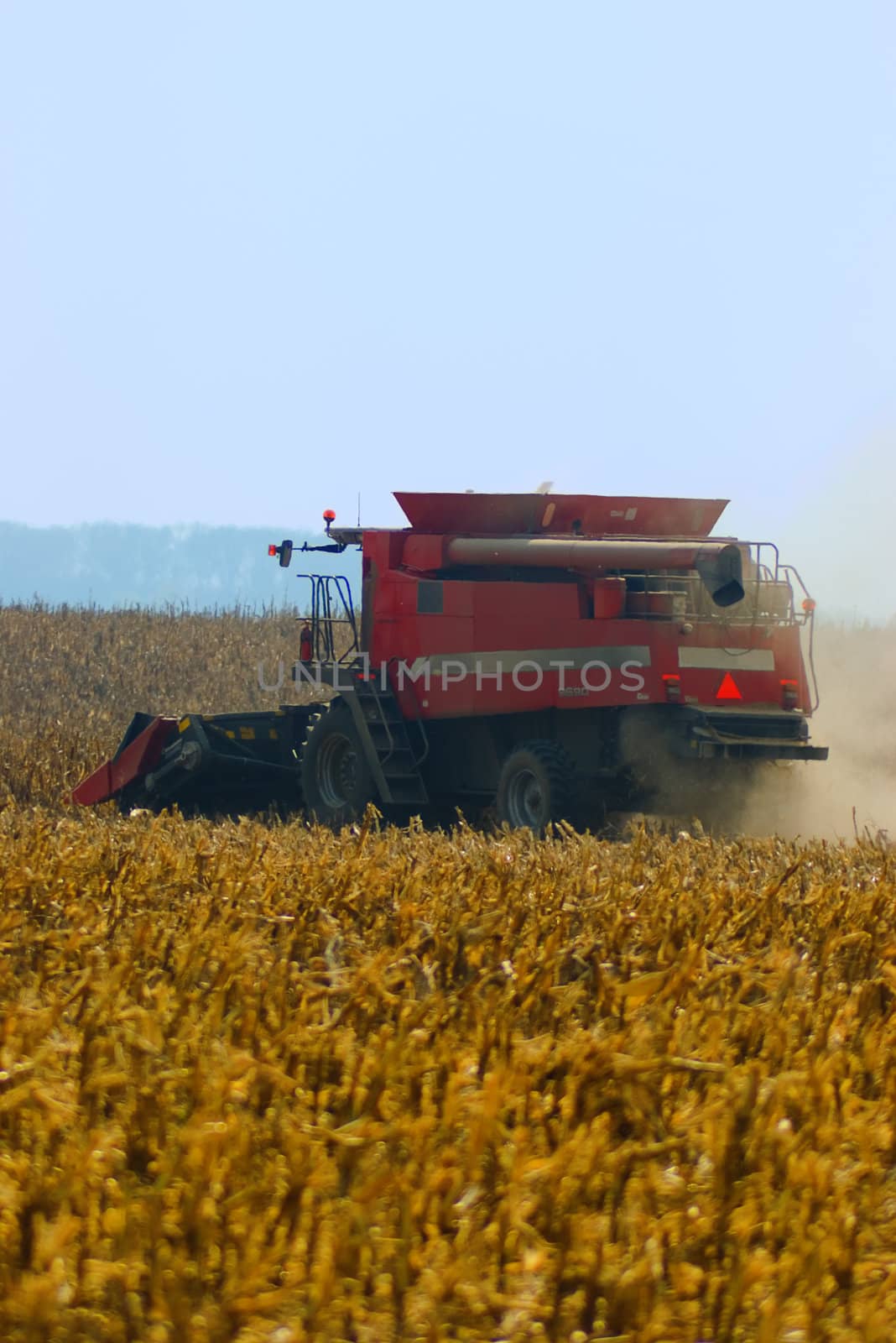 Combine harvesting a wheat field