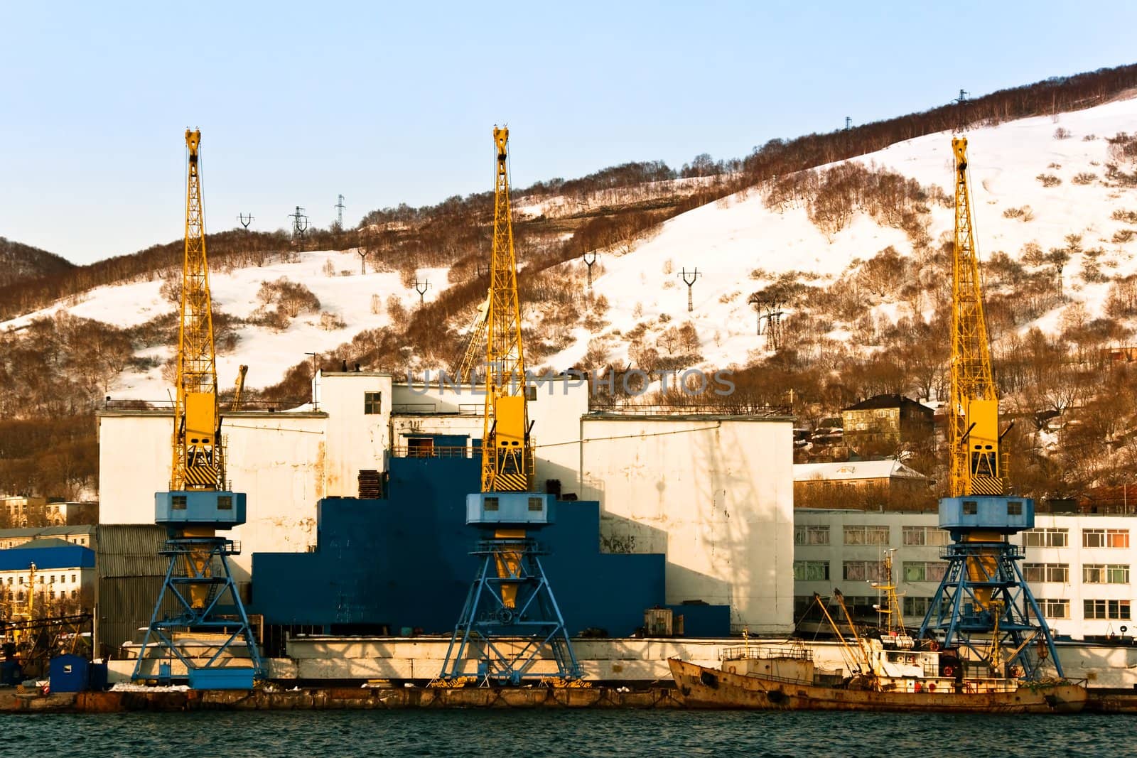 Elevating cranes in port on Kamchatka in Russia