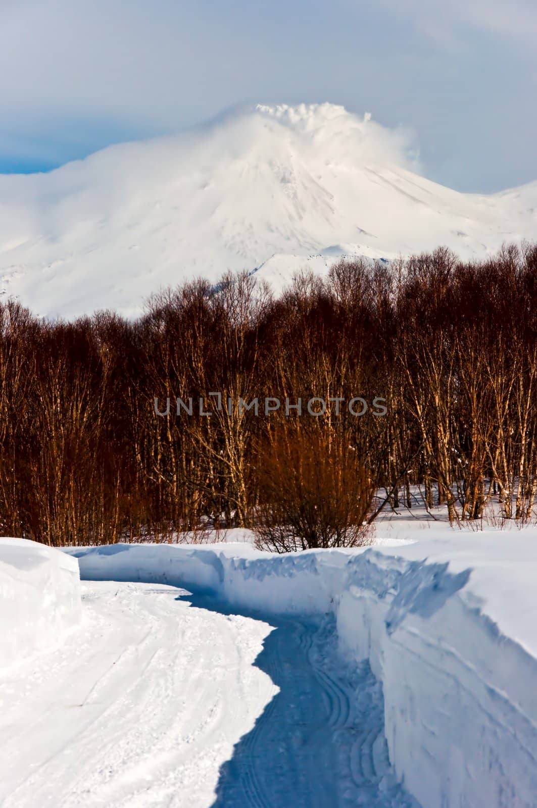 Road to snow to a beautiful volcano in Russia
