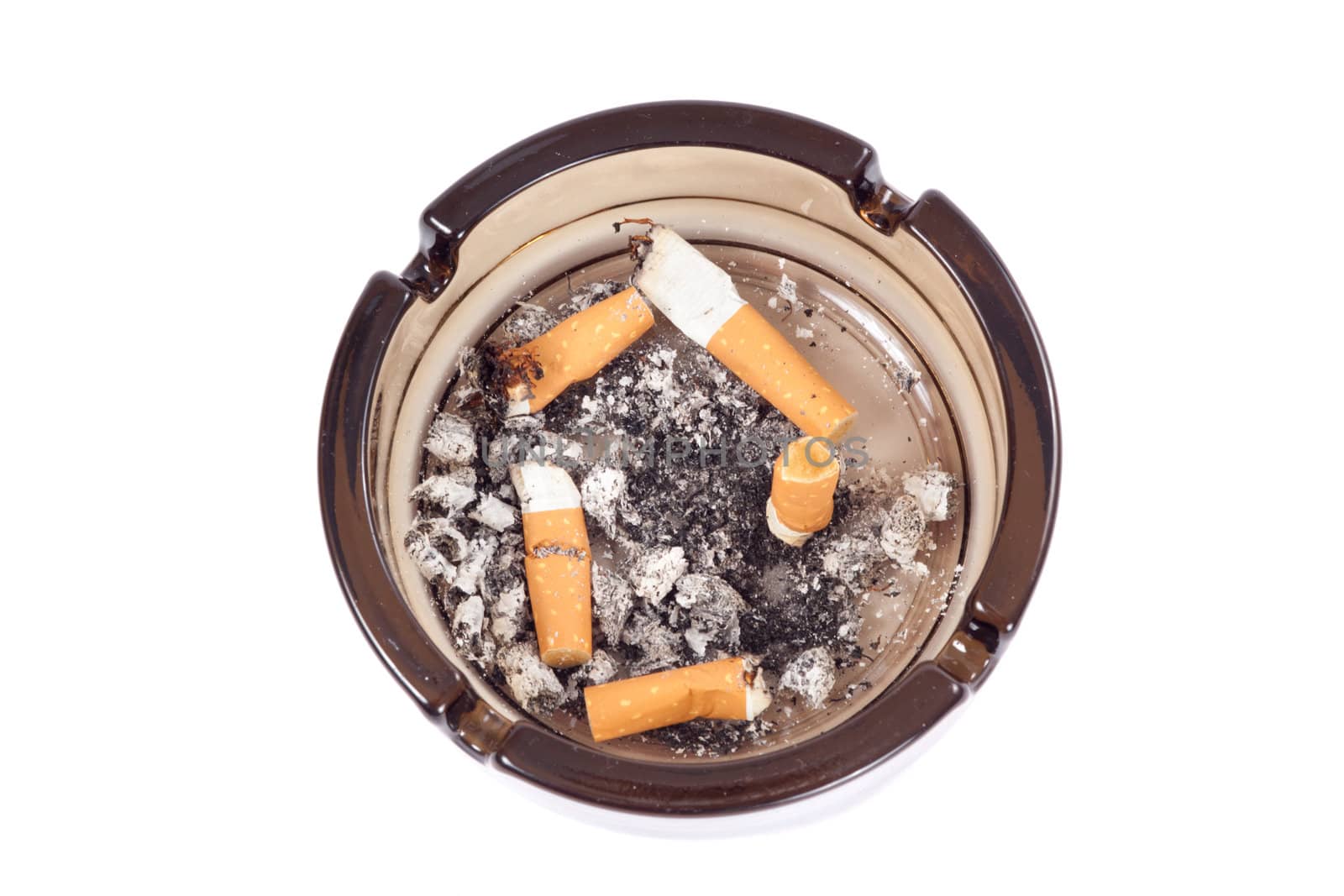 A flithy glass ash-tray, photo on the white background 