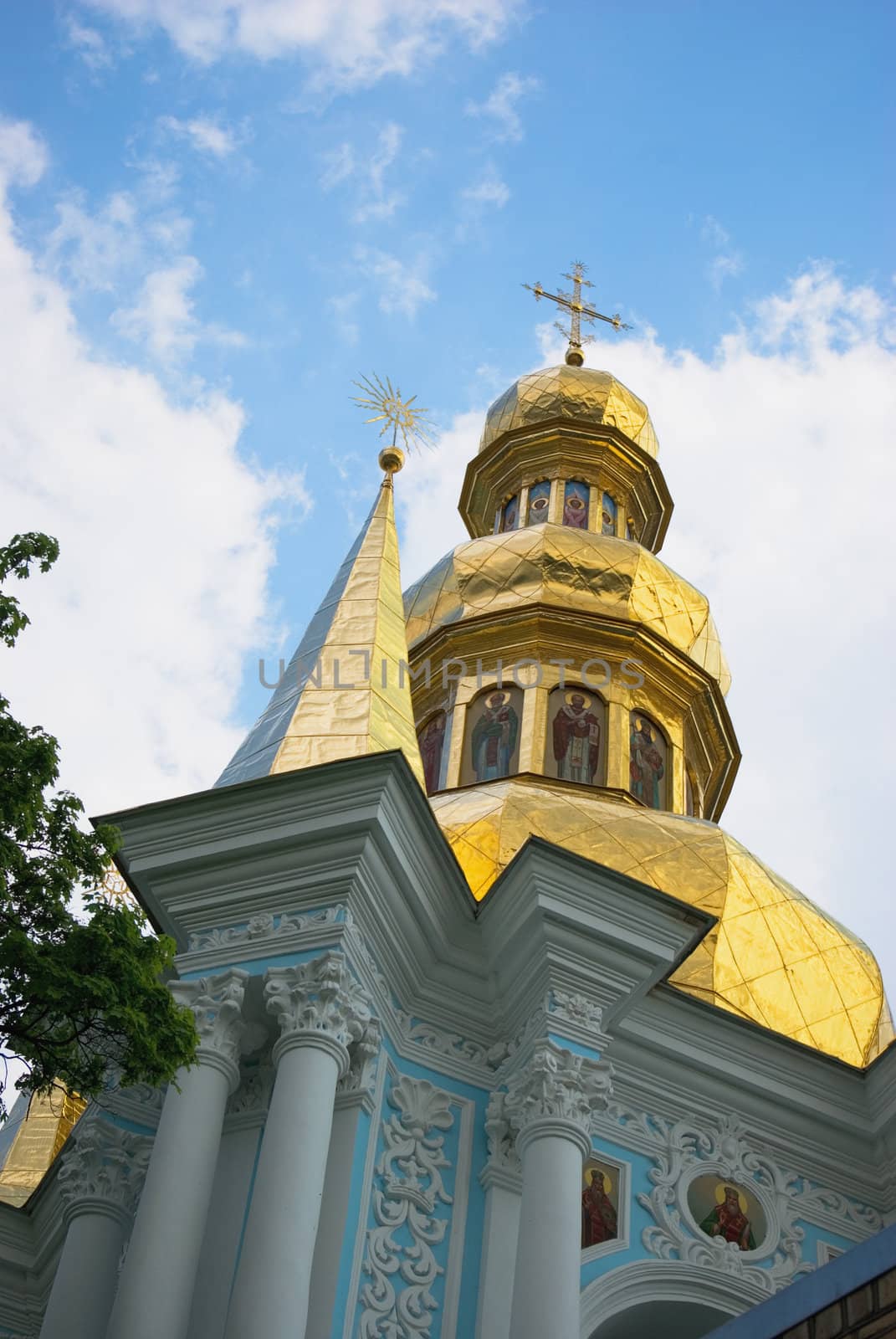 Domes of orthodox church on a blue sky background.