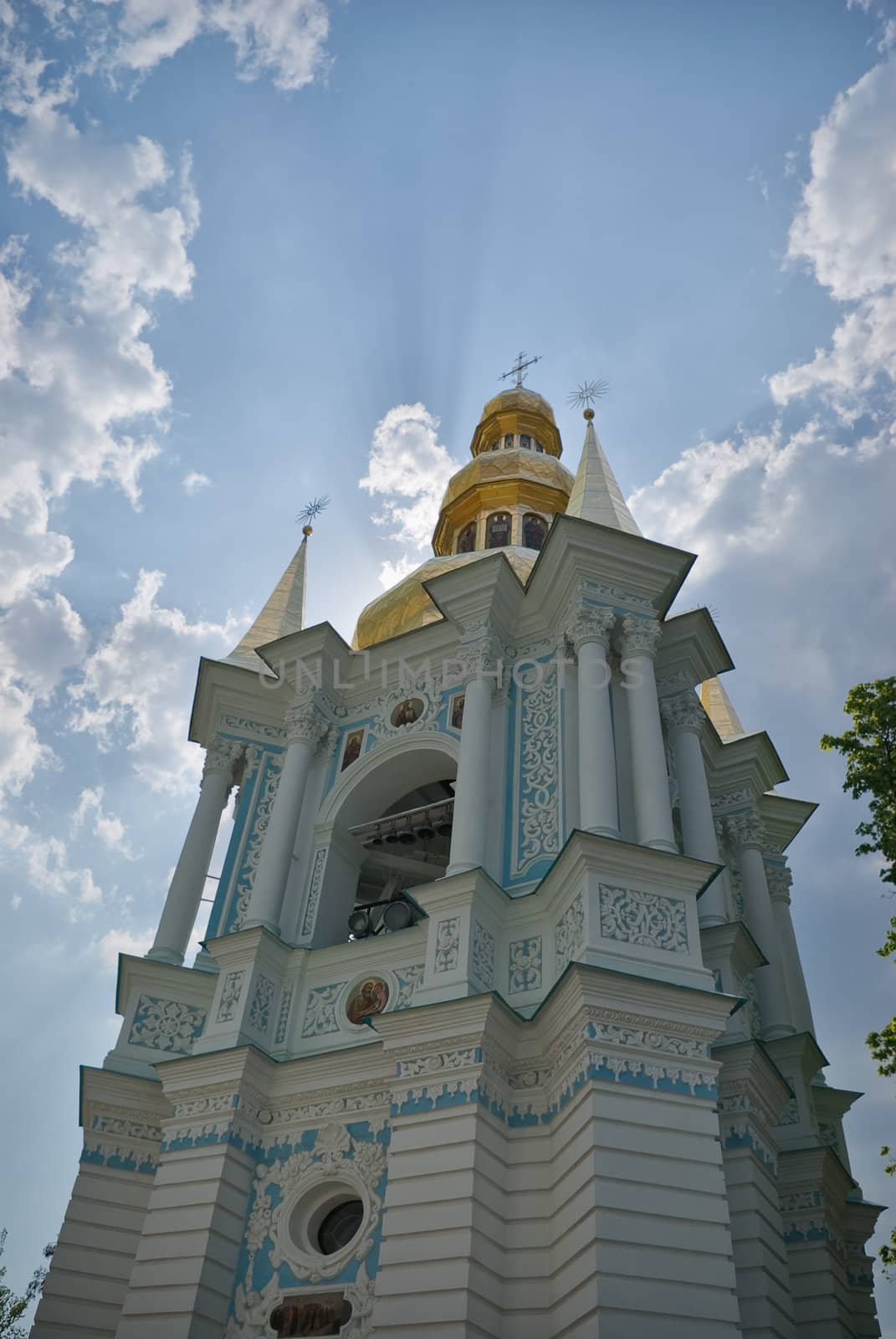 Golden church domes on blue sky background