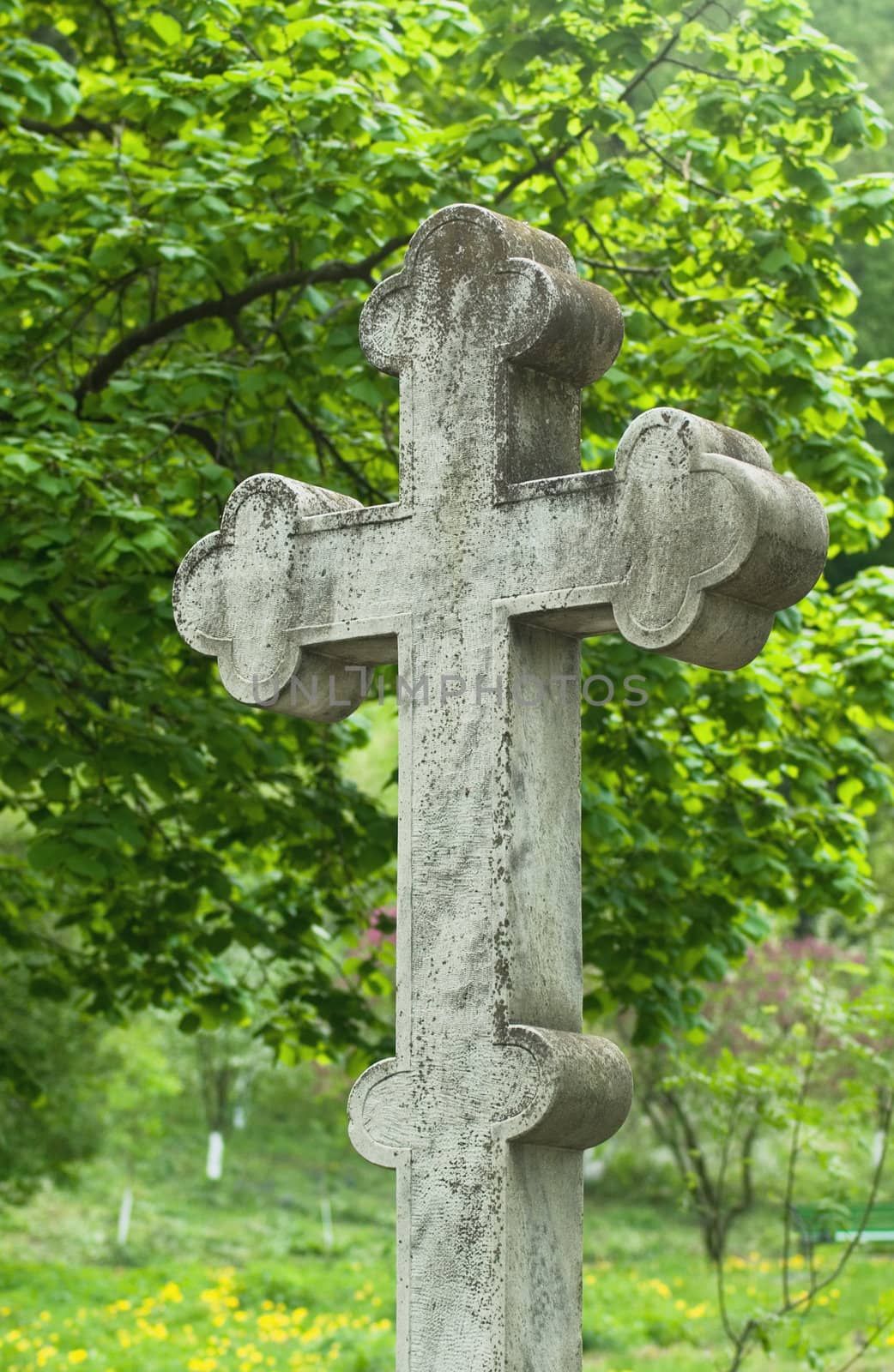 
christian stone cross on the unknown tomb