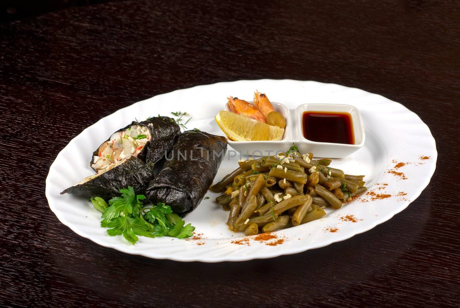 souffle of fillet of pikeperch, shrimps, crab meat, coconut and leek wrapped at nori garnished by string beans