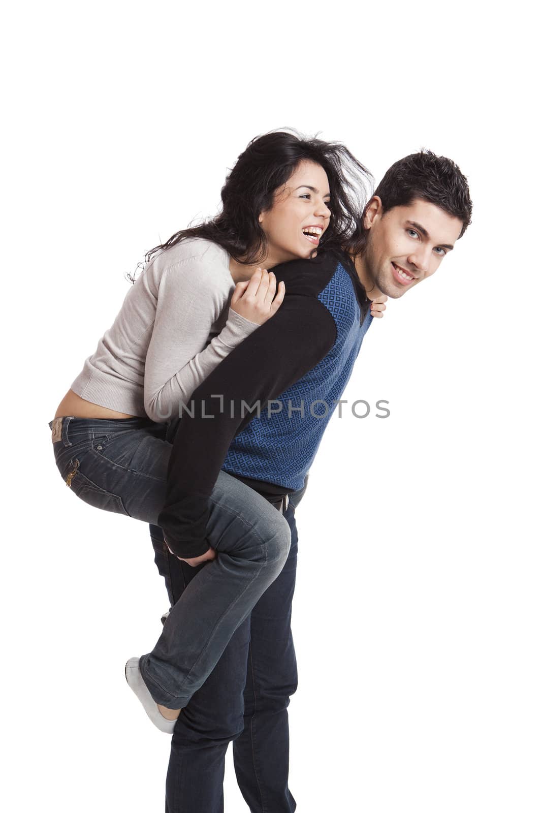 Attractive and happy young couple isolated over a white background