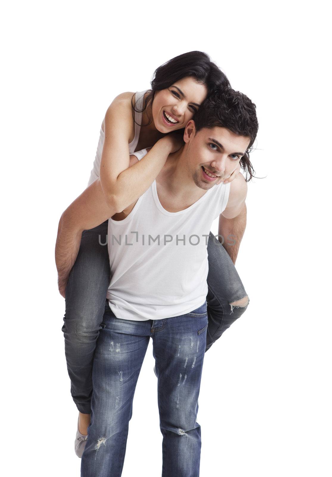 Beautiful and happy young couple standing over a white background