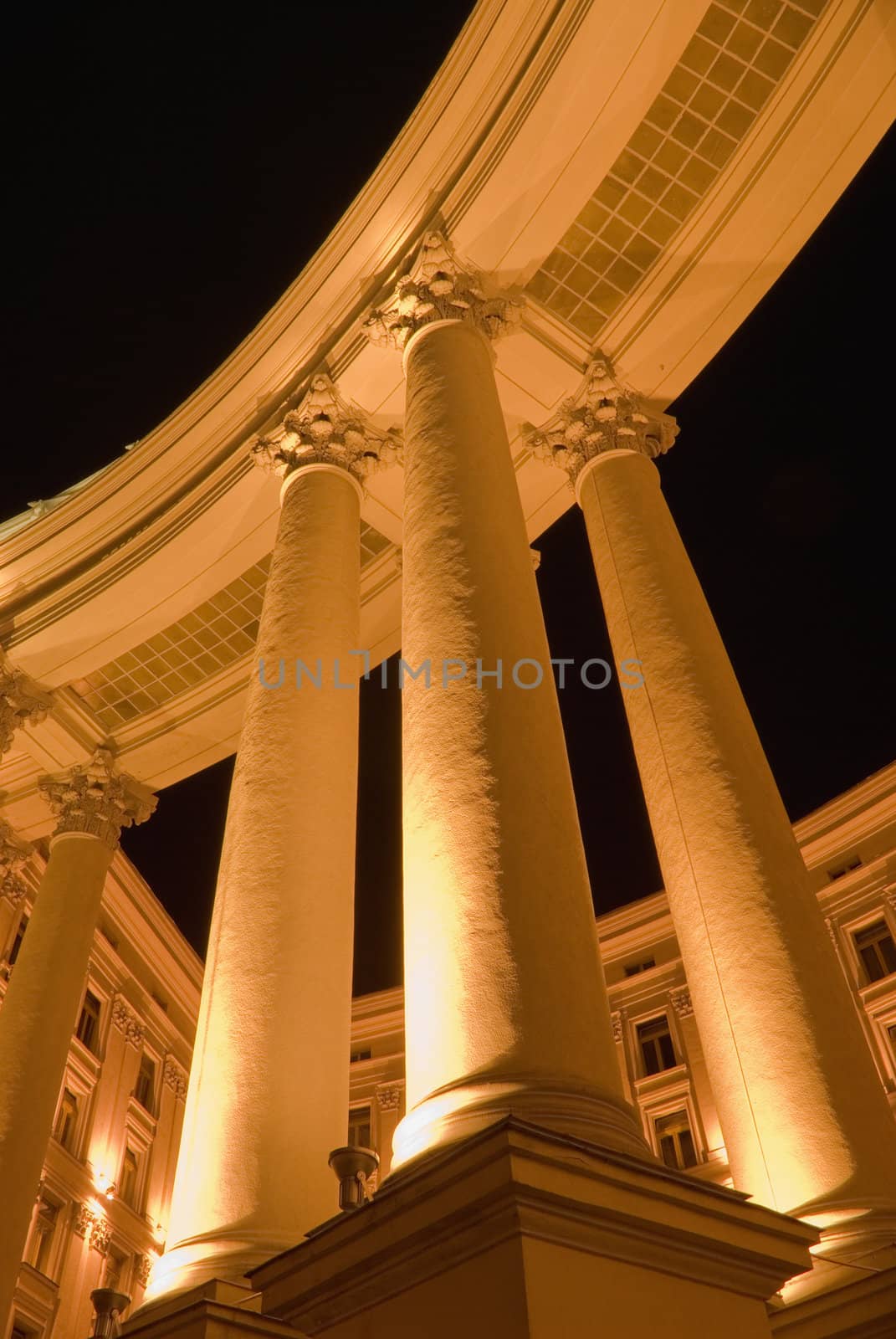 Columns of a building. A night photo, light from street lanterns
